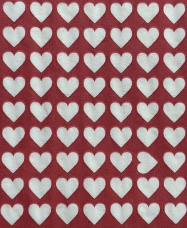 Sequential heart shapes pattern on red textured creative background