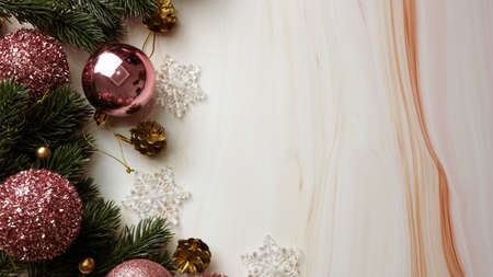 Green pine tree leaves, pink christmas decorations and candy canes on soft marble background, christmas decorations in bright and fancy pink color. Simple and creative christmas concept.の写真素材