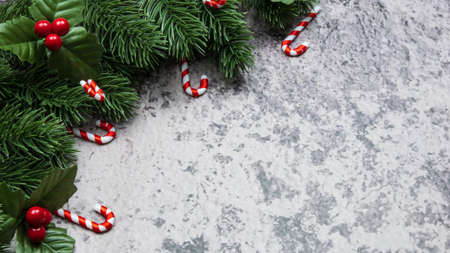 Christmas decorations, pine tree leaves, balls, berries on grunge background, Selective focus christmas conceptの写真素材
