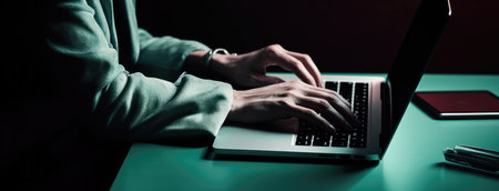 Hands of a person using a keyboard on a laptop. Dark aquamarine and gray color concept with Generative AIの素材