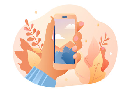 A hand holding a cell phone with a picture of a mountain on the screen. The image has a peaceful and...