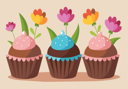 Three cupcakes with flowers on top are arranged on a table. The cupcakes are decorated with frosting and have a floral design. The arrangement gives off a cheerful and festive moodのイラスト素材