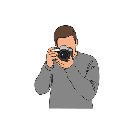 A focused man holds a camera, ready to take a photo, conveying a sense of creativity and enthusiasm.