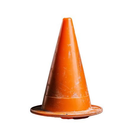 A single bright orange traffic cone displayed on a transparent background, commonly used in construction and road safety to guide and warn drivers. Perfect for safety illustrations and industry themes.の素材