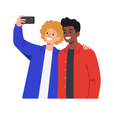 Two young men smile broadly as they pose for a selfie, wearing vibrant clothing and exuding a joyful...