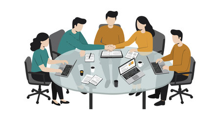 Five colleagues sit around a round table working on laptops and papers, engaging in teamwork and...