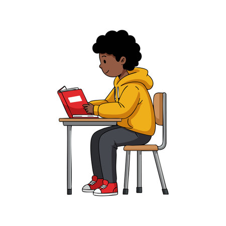 A young boy sits at a school desk focused on reading a red book, wearing a yellow hoodie and red sneakers, learning calmly.のイラスト素材