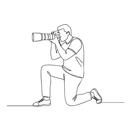 Illustration shows a photographer kneeling while taking a photo with a telephoto lens camera in simple line art style, focused and calm.のイラスト素材