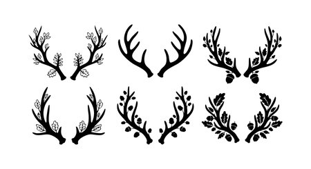 Black silhouette deer antlers decorated with leaves, berries, and pine cones in a vector illustration style, conveying nature and wildlife themes. Calm.のイラスト素材