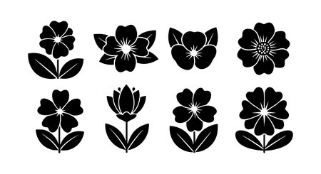 This vector set displays black silhouette flower icons featuring diverse floral shapes and leaf patterns, ideal for graphic design and decoration, presented in a simple style. Calm and elegant.のイラスト素材