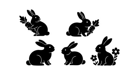 This vector image shows five black silhouette rabbits, some holding carrots and one near flowers, all sitting peacefully in various poses. The style is simple and clear, the mood is calm.のイラスト素材