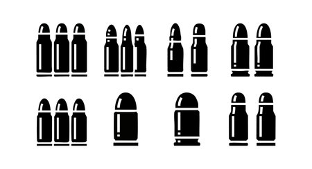 Vector file displaying multiple bullet cartridge icons in black silhouette, showing different sizes and shapes for versatile use in design, illustration, and graphic projects. Bold and clear.のイラスト素材