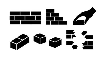 Vector icons showing brick wall construction process with hand placing bricks, broken bricks, and individual blocks. Simple black silhouette style. Clear and functional design. Practical.のイラスト素材