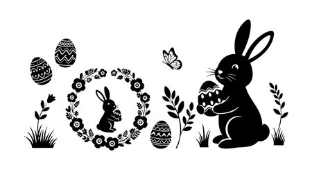 Silhouette of an Easter bunny holding a decorated egg surrounded by floral wreath, grass, and a butterfly in black vector style. Cheerful and festive mood.のイラスト素材