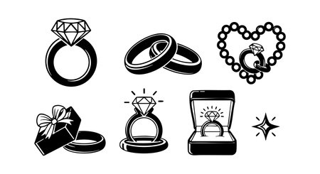 This vector set features diamond rings, wedding bands, a gift box, and a necklace with a heart charm, showing elegant jewelry designs in black and white style, refined and classic.のイラスト素材