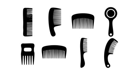 Vector illustration shows black silhouette hair combs in various styles and shapes used for grooming and hairstyling. The image is simple and clear with a neat design. Calm mood.のイラスト素材