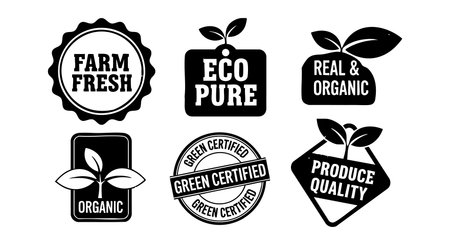 A collection of black and white organic labels showcasing farm fresh eco pure green certified produce quality with leaf motifs and natural themes for eco friendly product branding peacefulのイラスト素材