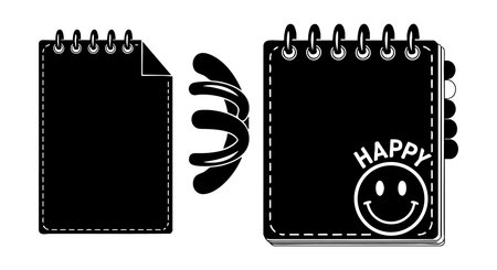 A vector illustration shows spiral bound notebook pages with one page turning and a happy face emblem on the cover. The design is simple and ideal for stationery or school themes. Cheerful and clean.のイラスト素材