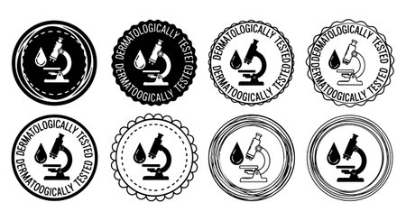 A collection of black and white dermatologically tested stamp icons featuring microscope and drop symbols inside various circular decorative borders, simple vector design.のイラスト素材
