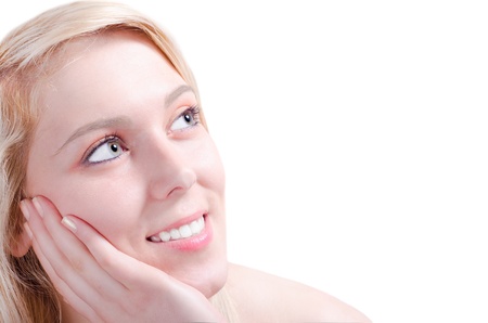 Beautiful young woman admiring happy with her head relaxed on her handの写真素材