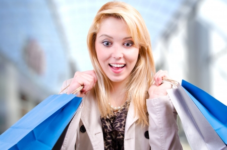 Young beautiful blonde Caucasian woman looking downwards surprised at copyspaceの写真素材