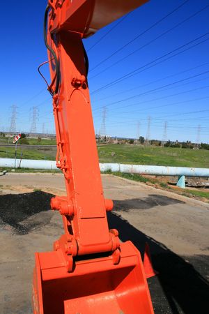 Orange excavator close up on a construction sight.の写真素材