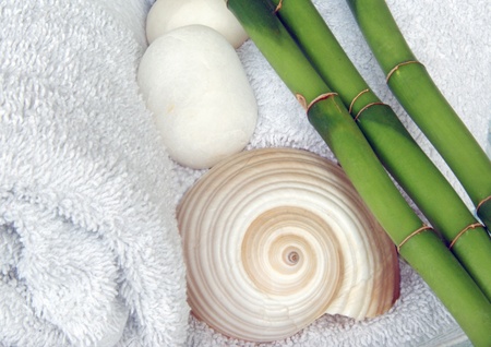 white towels with shell stones and bambooの写真素材