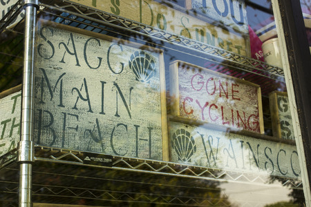 store front with wooden signs
