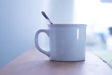 white cup of breakfast on the tableの写真素材