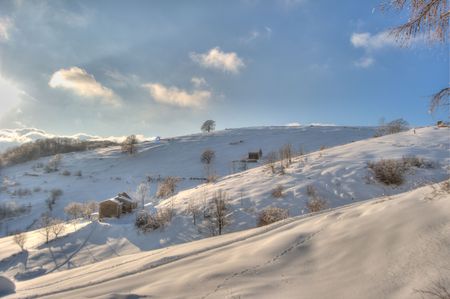 panoramic snowy view of a mountain landscapeの写真素材