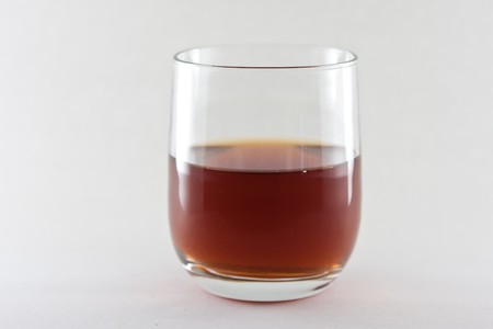 a transparent glass with a white backgroundの写真素材