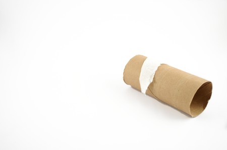 The end of a toilet paper roll on a white backgroundの写真素材