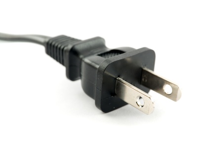 Male end of an electric cord on a white backgroundの写真素材