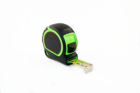 Green tape measure on a white backgroundの写真素材
