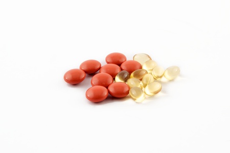 Different color pills on a white backgroundの写真素材