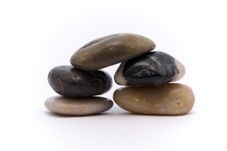 River stones stacked on a white background