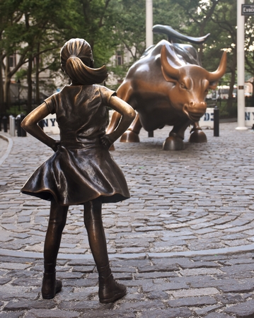 The Charging Bull and Fearless Girl statues in downtown Manhattan on Wall Street in New York Cityのeditorial素材