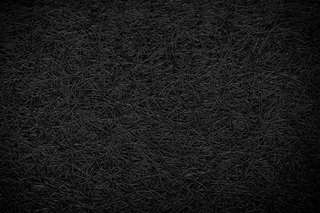 Compressed vegetable textured background in a black and white, dark and low contrast tonalityの写真素材