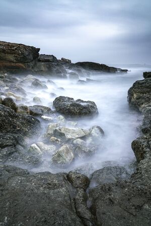 Mystical and magic moody long exposure shot, water seems like fog, of a mediterranean landscape of a...
