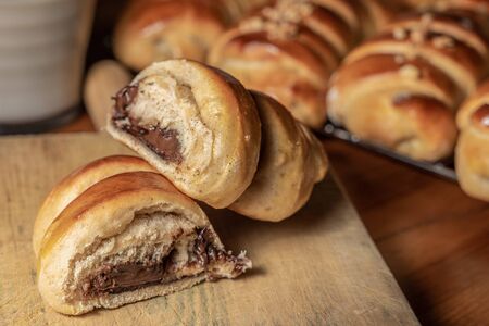 Delicious french sweet baked brioche buns, stuffed with chocolate and nuts