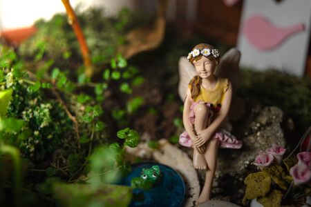 Beautiful decorative miniature fairy for garden or pot, in a small idyllic and fantasy gardenの写真素材