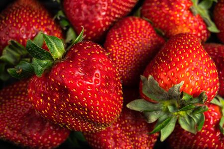Vibrant image of several delicious fresh strawberries close upの写真素材