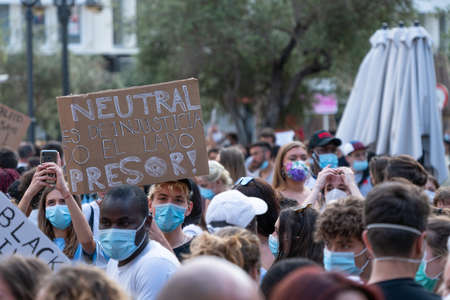 Palma, Majorca, Spain - June 7, 2020: Demonstration against racism, people holding placards and...