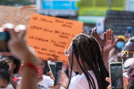 Palma, Majorca, Spain - June 7, 2020: African American black woman giving a protest speech, claiming...