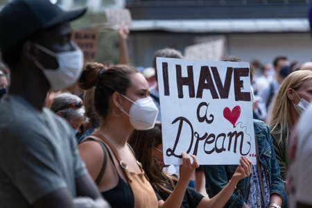 Palma, Majorca, Spain - June 7, 2020: People holding claiming banner during anti-racism protest. I...