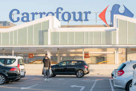 Palma, Majorca, Spain - January 16, 2021: Facade of the Carrefour shopping center, from the parking...