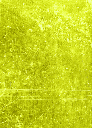 Abstract background textured in fresh lemon and lime tones with scratches and stains.の写真素材