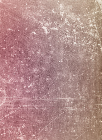 Abstract background textured in purple and sepia tones with scratches and stains.の写真素材