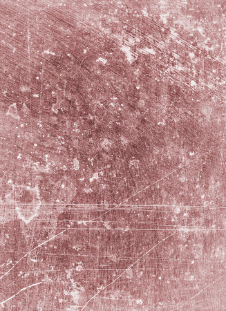 Background textured in old pink tones with scratches and stains.の写真素材