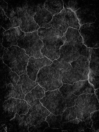 Abstract background textured in black tones with bright cracks.の写真素材
